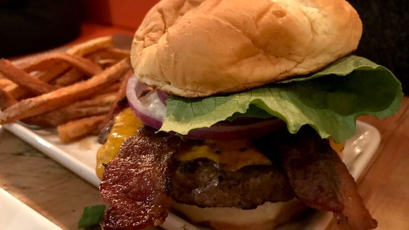 The food at Lock 27 in downtown Dayton. Pictured: Lock 27's Keener Burger served with bacon and an egg added. Photo by Amelia Robinson