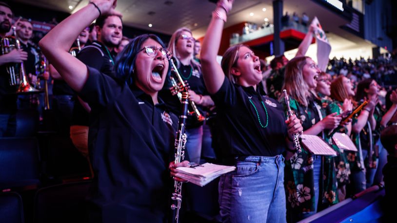 WSU students cheer on the Raiders' first NCAA tournament men's victory Wednesday, March 16, 2022, at the University of Dayton Arena. JIM NOELKER/STAFF