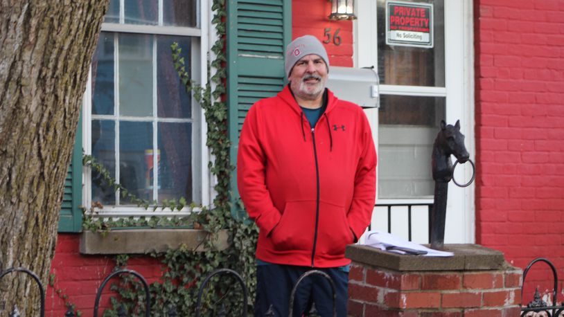 Greg Soete stands outside his home on Drummer Avenue in the Necombs Plain neighborhood in east Dayton. Soete applied for two parcels through Lot Links in mid-2016 to turn into a side yard and garden but is still waiting for the properties to be transferred to him. CORNELIUS FROLIK / STAFF