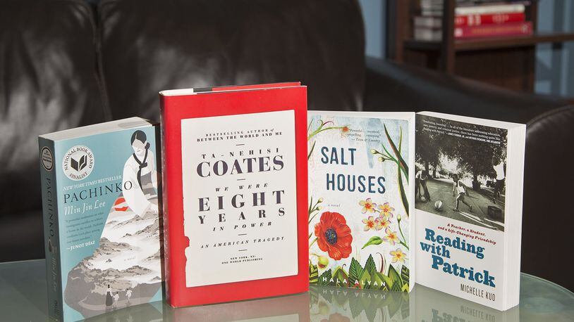 The books from Dayton Literary Peace Prize winners: “We Were Eight Years in Power” by Ta-Nehisi Coates, “Salt Houses” by Hala Alyan, and runners-up “Pachinko” by Min Jin Lee and “Reading with Patrick” by Michelle Kuo. TY GREENLEES / STAFF
