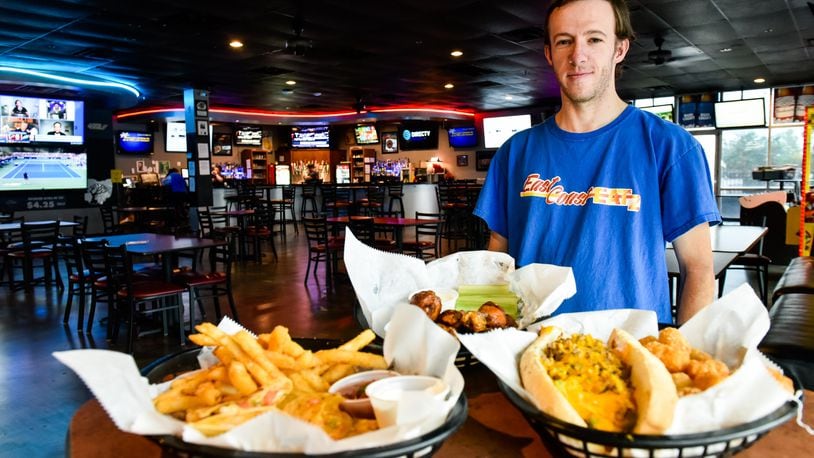Mike Martin, owner of East Coast Eatz food truck, has taken over the kitchen at The Draft Bar & Grille on Yankee Road in Liberty Township. The menu has been revamped and includes many new items including Philly cheesesteak, smoked wings and quesadillas. NICK GRAHAM / STAFF