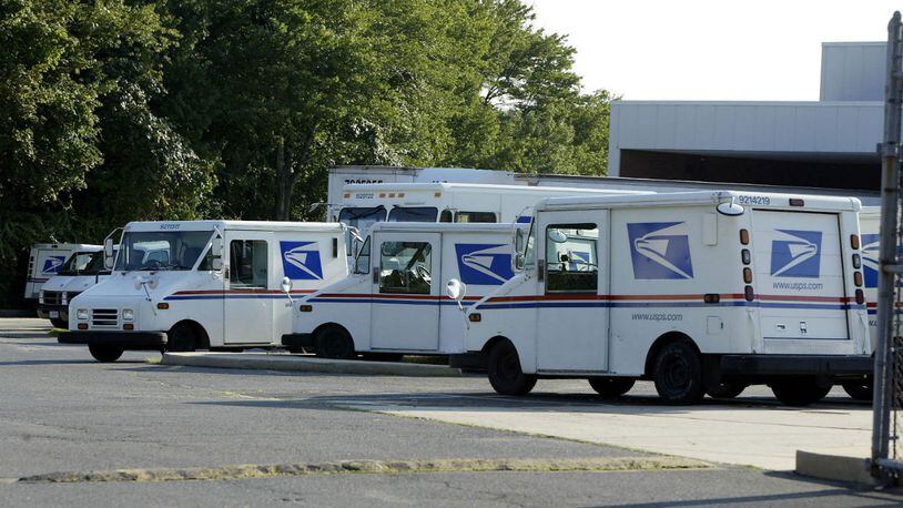 Trucks are seen parked at a U.S. Postal facility.