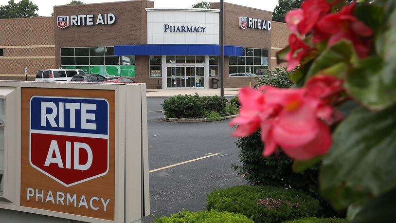 Rite Aid is cutting 400 full-time jobs and three its top leaders are leaving the company. BILL LACKEY/STAFF