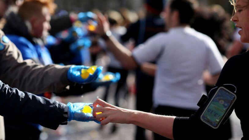LONDON, ENGLAND - MARCH 10: Competitors use the Lucozade Sport trial Ooho on course during the Vitality Big Half on March 10, 2019 in London, England. (Photo by Charlie Crowhurst/Getty Images for Lucozade Sport)