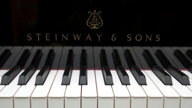 A Steinway & Sons piano is displayed at Steinway Hall, the manufacturer's showroom in New York, on Monday, June 21, 2004. Steinway & Sons is a unit of Waltham, Massachusetts-based Steinway Musical Instruments Inc. and has been manufacturing pianos in New York since 1853. Photographer: Daniel Acker/Bloomberg News