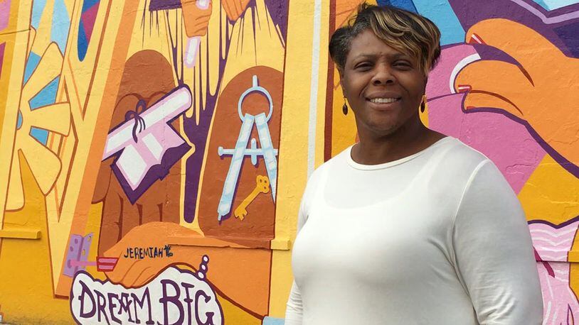 Yvette Kelly-Fields, executive director, The Wesley Community Center.  Wesley, which was founded 50 years ago in response to the 1966 riot, added this mural of a community rebuilding this summer.  JOSH SWEIGART / STAFF