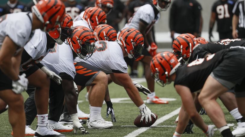 Cincinnati Bengals center Billy Price, center, lines up a play during practice at the team’s NFL football facility, Wednesday, June 12, 2019, in Cincinnati. (AP Photo/John Minchillo)