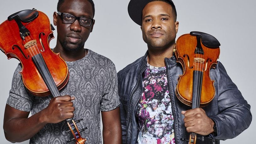 Classically trained violist Wil B. (Wilner Baptiste, left) and violinist Kev Marcus (Kevin Sylvester), better known as Black Violin, will perform Oct. 24 at the Schuster Center. CONTRIBUTED