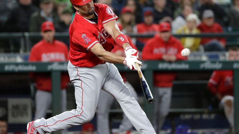 Albert Pujols singles against the Seattle Mariners in the fifth inning off Mike Leake to collect his 3,000th career hit Friday night in Seattle.