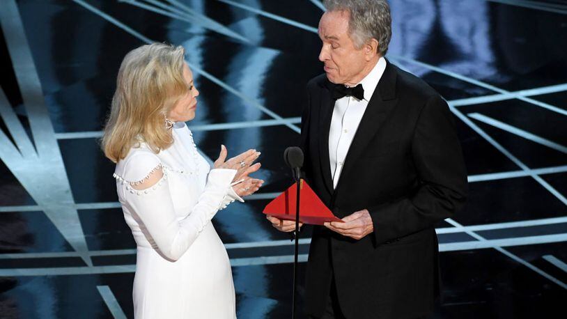 HOLLYWOOD, CA - FEBRUARY 26:  Actors Faye Dunaway (L) and Warren Beatty speak onstage during the 89th Annual Academy Awards at Hollywood & Highland Center on February 26, 2017 in Hollywood, California.  (Photo by Kevin Winter/Getty Images)