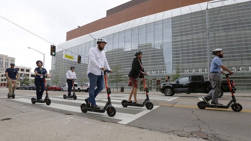 Spin electric scooters have returned to downtown Dayton for 2021. FILE