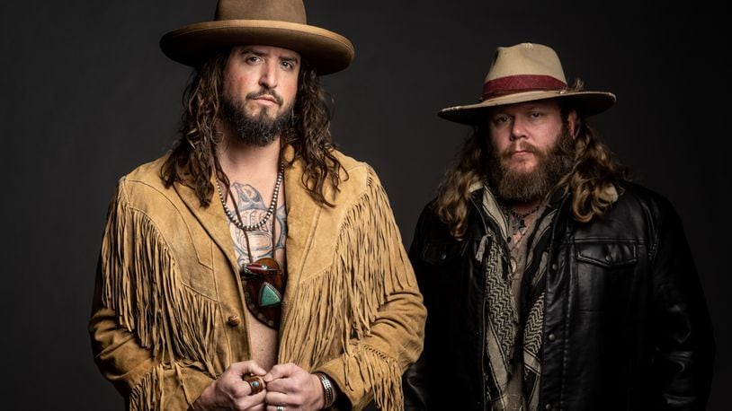 Cincinnati native Donnie Reis (right) and Scooter Brown of Nashville-based country act War Hippies, opening for Travis Tritt at Hobart Arena in Troy on Thursday, March 30, are both former military and combat veterans. CONTRIBUTED
