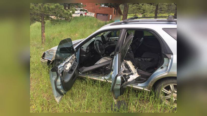 A bear broke into an unlocked car and accidentally put it into neutral, causing the vehicle to coast 100 feet down a hill, deputies said. (Photo: Boulder County Sheriff's Office)