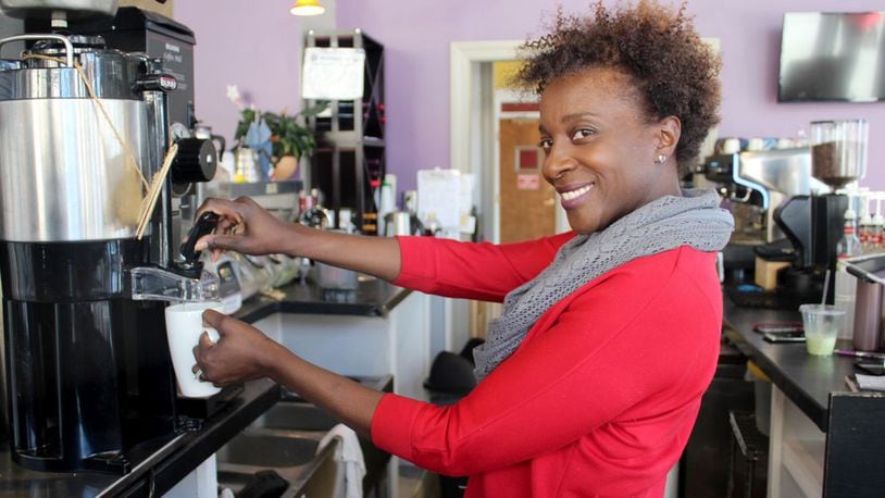 Juanita Darden, founder and owner of Third Perk Coffeehouse & Wine Bar, is planning to open a fourth shop in Beavercreek. STAFF