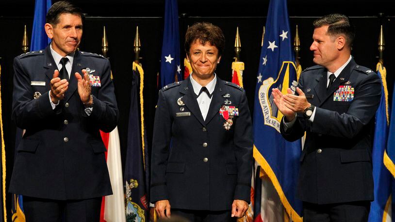 Col. Cassie Barlow, former Wright-Patterson Air Force Base commander, is among the 2018 inductees to the Ohio Veterans Hall of Fame. Barlow was replaced by Col. John Devillier (right), following her retirement from the Air Force. LISA POWELL/FILE