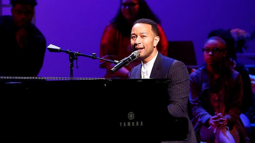 John Legend performs on stage during a concert following the ribbon cutting for the new John Legend Theater. Bill Lackey/Staff