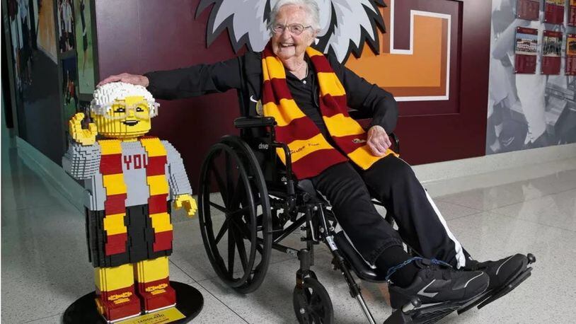 Sister Jean Dolores Schmidt, who turned 100 Wednesday, poses with her Lego look-alike Tuesday.