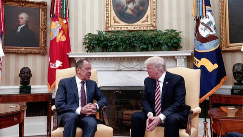 US President Donald Trump, right, meets Russian Foreign Minister Sergey Lavrov at the White House in Washington, Wednesday, May 10, 2017. President Donald Trump on Wednesday welcomed Vladimir Putin's top diplomat to the White House for Trump's highest level face-to-face contact with a Russian government official since he took office in January. (Russian Foreign Ministry Photo via AP)