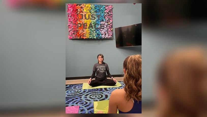Kali Macklin of the Traditional Yoga Society leads a weekly yoga practice at the International Peace Museum.